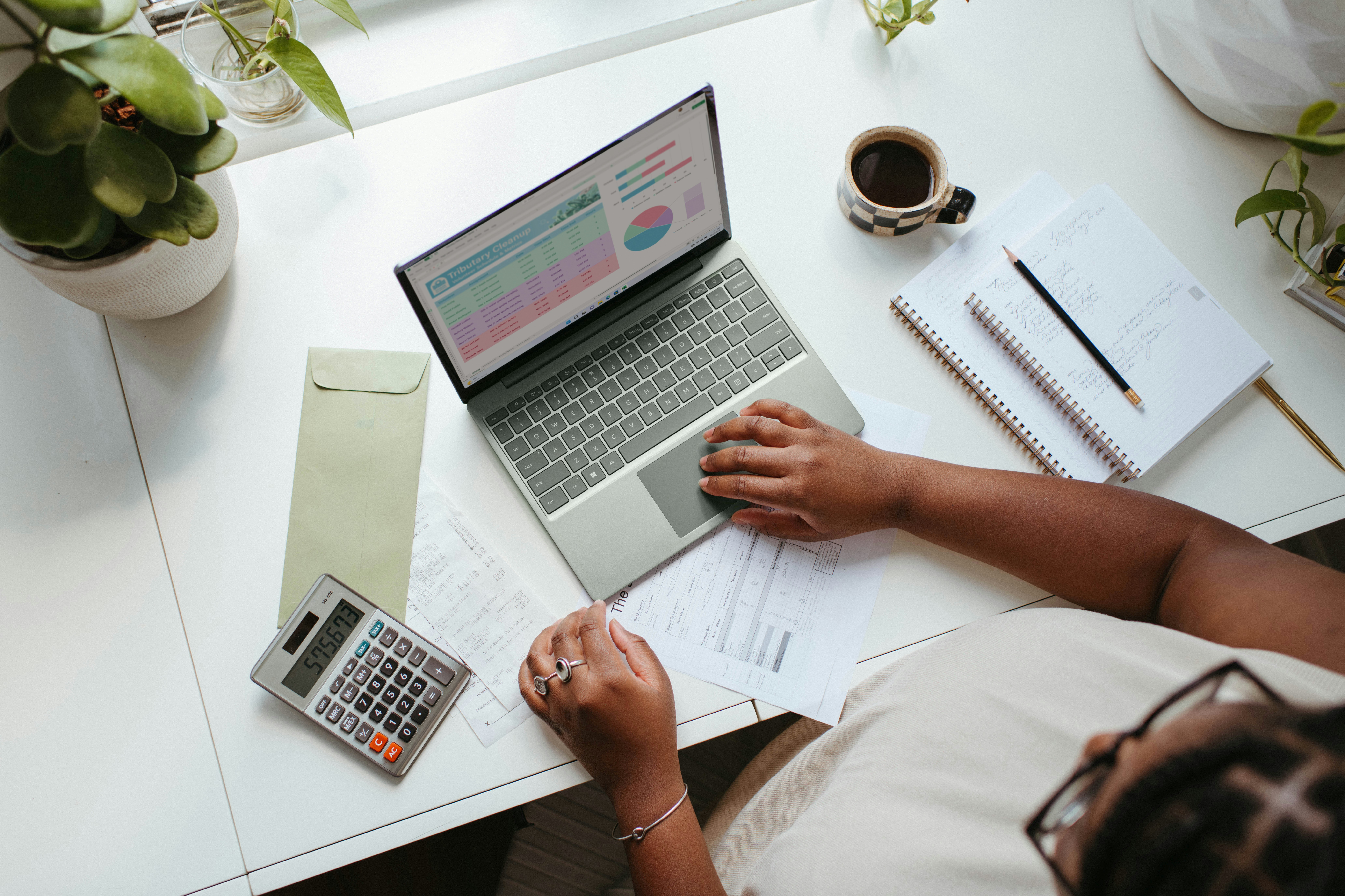 A person reviewing their bookkeeping for their business.